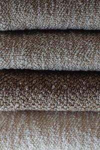 Kaboompics - Close-Up of Rolled Neutral Bouclé Upholstery Fabric Samples