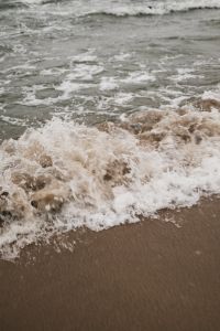 Kaboompics - Frothy Wave Breaking on the Beach