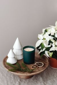 Kaboompics - Holiday Still Life with Candles, Paper Trees and Poinsettia