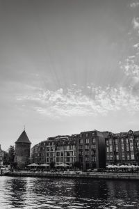 Kaboompics - Black and White Gdańsk Motława Waterfront with Historic Tower and Riverside Buildings