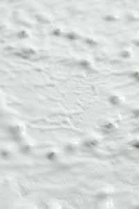 Kaboompics - Close-Up White Plaster Background with Fine Diagonal Brush Ridging and Surface Dents