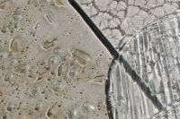 Kaboompics - Angled Glass Panel Casting a Patterned Shadow on a Pale Surface