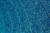 Kaboompics - Blue Swimming Pool Mosaic Tiles with Long Sunlit Ripples, Abstract Water Texture