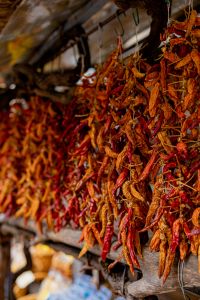 Kaboompics - Red And Orange Dried Chilis Hanging At Street Market