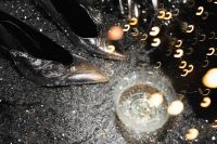 Kaboompics - Champagne Coupe with Silver Tinsel and Golden Bokeh