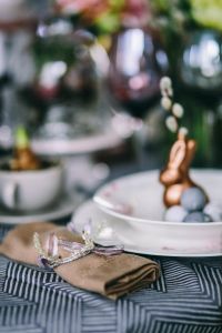 Kaboompics - Round dinner table decorated with easter motifs