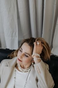 Kaboompics - Close-Up Portrait with Layered Pearl Necklaces and Beige Blazer
