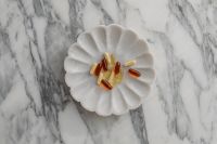 Kaboompics - Assorted Supplements on a White Decorative Plate
