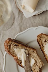 Kaboompics - Buttered Bread and Wine Glass Detail