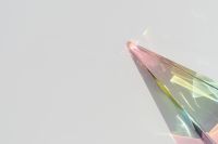 Kaboompics - Extreme Close-Up of Iridescent Prism Refractions with Soft Neutral Copy Space
