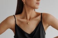 Kaboompics - Black Satin Camisole with Gold Pendant Necklace