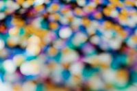 Kaboompics - Blurred Rainbow Sequin Highlights on Dark Textile, Abstract Glitter Background