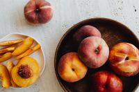 Kaboompics - Peach and Nectarine Still Life with Sliced Fruit and Wooden Bowl