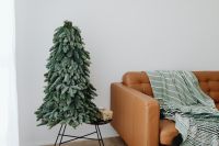 Kaboompics - Holiday Living Room With Green Tree and Tan Leather Sofa