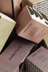 Kaboompics - Bold Geometric Pattern on Neutral Candle Packaging