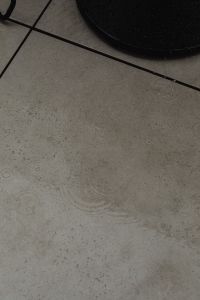 Kaboompics - Rainy Patio Floor With Black Wire Chair Detail