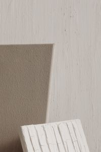 Kaboompics - Layered Beige and White Paint Texture Samples on a Textured Wall