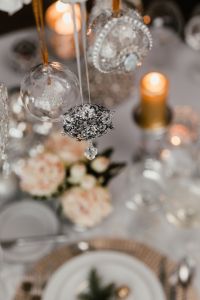 Kaboompics - Silver Baubles Suspended above an Elegant Christmas Table