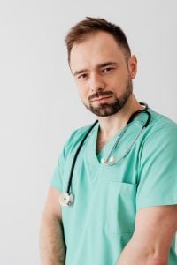 Young Male Doctor in Mint Scrubs for Healthcare Campaigns, Patient Education and Medical Training