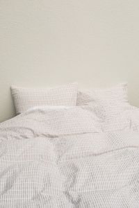Kaboompics - Checkered Bedding and Pillows on a Minimal Bed