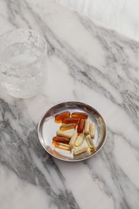Kaboompics - Vitamins and Capsules in a Bowl on Marble