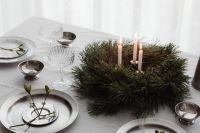Kaboompics - Wide Holiday Dinner Table with Lit Advent Wreath, Crystal Glasses and Silver Place Settings
