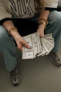 Kaboompics - Woman Sitting With Cash Wealth Aesthetic