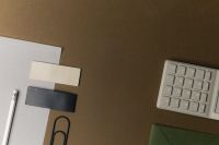 Kaboompics - Minimal Office Desk Flat Lay with Calculator, White Paper, Pencil and Paper Clip on Brown Background