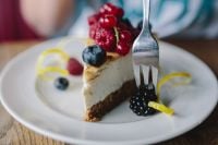 Kaboompics - Berry Cheesecake Slice with Blackberries on White Plate