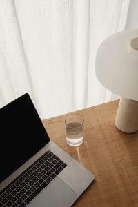 Kaboompics - Minimal Stone Table Lamp and Water Glass by a Sheer Window