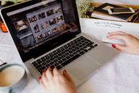 Kaboompics - Woman Typing on Laptop and Writing in a Notebook with Coffee, Home Working from Bed