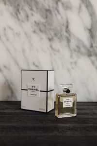 Kaboompics - Chanel No. 5 Perfume and Box on Dark Wood