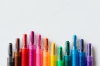 Kaboompics - Upright Rainbow Crayons on White with Copy Space for School and Art Project Design