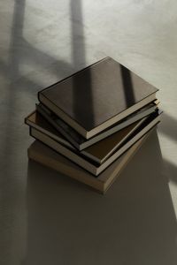 Kaboompics - Stack of Books in Sunlight on Neutral Interior Floor