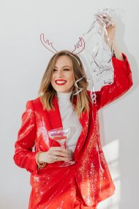 Kaboompics - Close-Up Red Blazer Portrait with Antler Headband and Party Decor