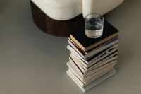 Kaboompics - Cozy Reading Corner with Glass of Water and Stack of Books