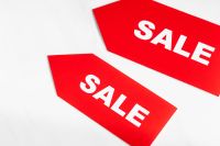 Kaboompics - Red Sale Tags on White Background for Retail Advertising