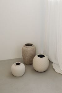 Kaboompics - Minimal Beige Interior with Textured Ceramic Vase and Sheer Curtain