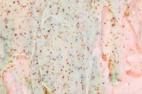 Kaboompics - Blush and Mint Skincare Foam Spread with Fine Brown Exfoliating Specks, Wide Macro
