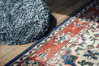 Kaboompics - Blue Patterned Rug with Textured Pouf