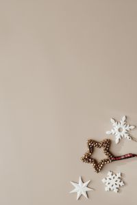Kaboompics - Minimal Christmas Flat Lay with Snowflake, Paper Star and Gold Decoration