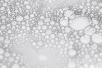 Kaboompics - Horizontal Macro Foam Bubble Surface with Gentle Blur and White Negative Space