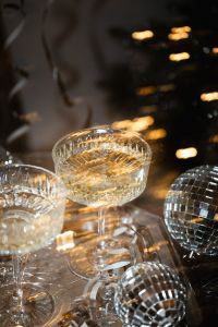 Kaboompics - Champagne Coupe and Disco Balls with Warm Golden Bokeh