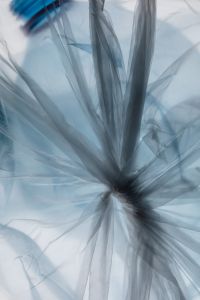 Kaboompics - Crumpled Translucent Plastic Film with Blue Gray Folds, Abstract Waste and Pollution Background Texture