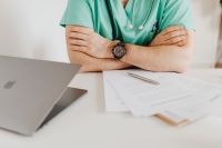 Kaboompics - Doctor Waiting Beside Laptop and Documents