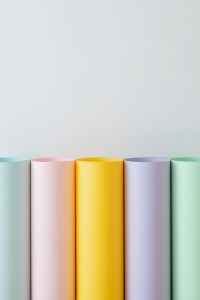 Kaboompics - Row of Five Colored Paper Rolls with White Copy Space