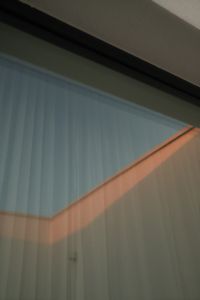 Kaboompics - Glass Building Facade with Reflections and Diagonal Sunlight