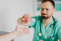 Kaboompics - Doctor Presenting Ointment Tube During Consultation