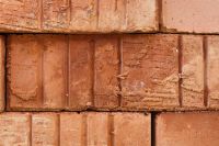 Kaboompics - Rustic Terracotta Brick Wall Texture with Layered Rows