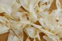 Kaboompics - White Flower Petals with Loose Pollen on Wood Texture